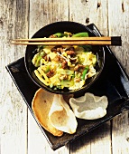 Asian stew and prawn crackers