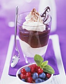 Layered chocolate and mascarpone dessert with cream