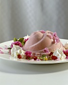 Strawberry mousse on plate with flowers & wild strawberries