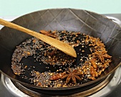 Toasting spices in a dry frying pan
