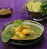 Fish fillets in green sauce