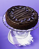 Chocolate truffle cake with candied violets