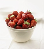 Fresh strawberries in white basin