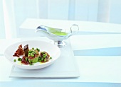 Pata negra with peas, mint and charcoal oil