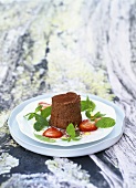 Chocolate mousse with peppermint salad and strawberries