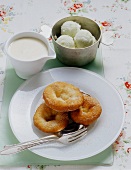 Swabian carneval cakes with a white wine cream and apple sorbet