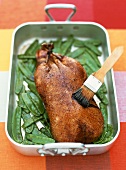 Roast duck with a vinegar-caramel sauce and mangetout