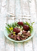 A fillet steak with poached red-wine apples