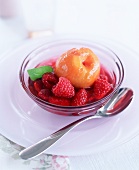 Rosé wine-poached peach with raspberries
