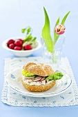 Radishes and quark on a sesame seed roll
