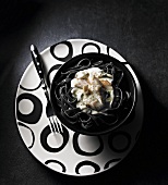 Squid ink pasta with smoked trout and goat's cheese sauce