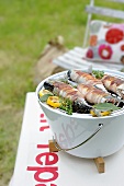 Mackerel wrapped in bacon on the barbeque