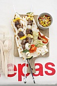 Grilled beef kebabs with tomato-mango salsa