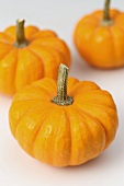 Three orange mini pumpkins