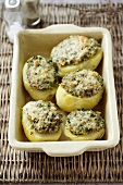 Potoates with a mushroom filling in a baking dish