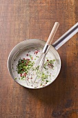 Creamy herb sauce with pink pepper