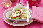 Avocado and tomato salad with onions and goat's cheese