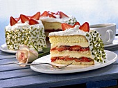 Strawberry layer cake with cream and pistachios