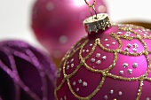 Purple and pink Christmas baubles (close-up)