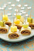 Pancake rolls filled with chocolate and topped with fruit