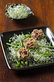 Mushrooms stuffed with rice on a bed of sprouts