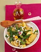 Potato salad with green asparagus, eggs and daisies
