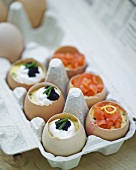 Boiled eggs with sour cream, caviar and salmon