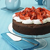 Chocolate cake with strawberries and cream