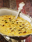 Cream of saffron soup with pistachios