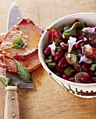 Bean salad with fried Kassler (smoked, cured pork)