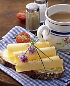 Bread and cheese with milky coffee