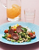 Couscous salad with sausage and cocktail tomatoes