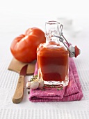 Home-made tomato ketchup in glass bottle