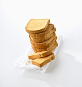 Zwieback, stacked, on tea towel