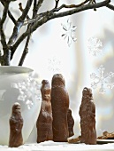 Vase of twigs with crystal stars, chocolate Father Christmases