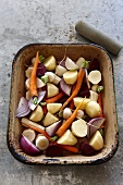 Vegetables (potatoes, carrots, onions), ready for roasting