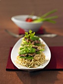 Fried noodles with beef and mangetout