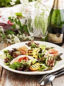 Salad leaves with figs and prosciutto, sparkling wine