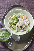 Chicken soup with vegetables and pesto