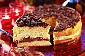 Sponge cake with chocolate shavings, a piece cut