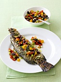 Fried fish with tomato and olive salsa