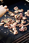 Frying marinated octopus