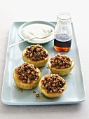 Stuffed baked apples, cream and maple syrup