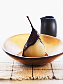 Poached vanilla pear with chocolate sauce