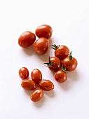 Various types of cherry tomatoes with drops of water