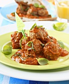 Meatballs with tomato sauce and basil