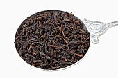 Lapsang souchong tea from China (tea leaves on spoon)