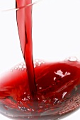 Pouring red wine (close-up)