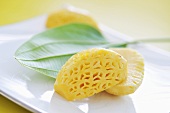 Baby pineapple, halved and peeled