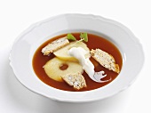 Warm rose hip soup with apple and whipped cream